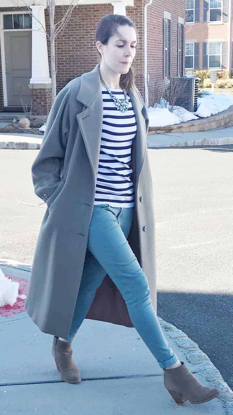 A woman happy with shoulder pads removed from vintage coat