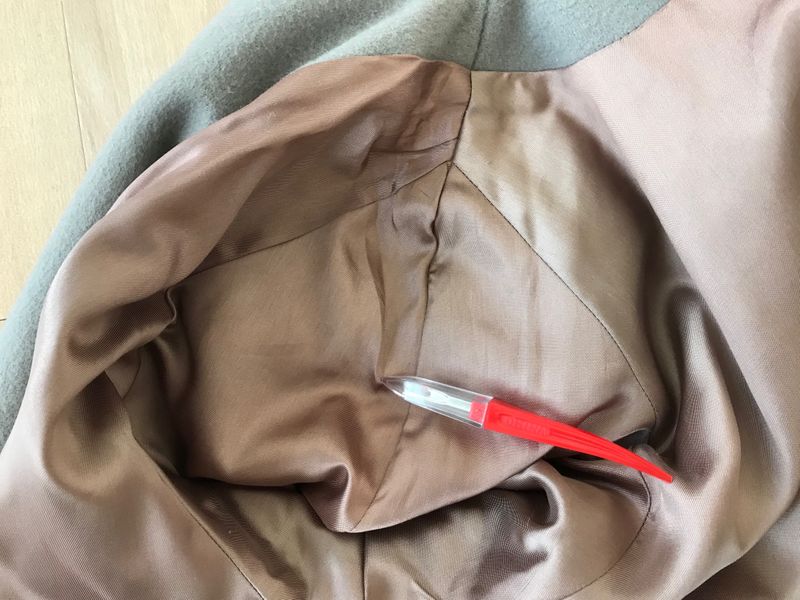 Opening a seam to remove shoulder pads