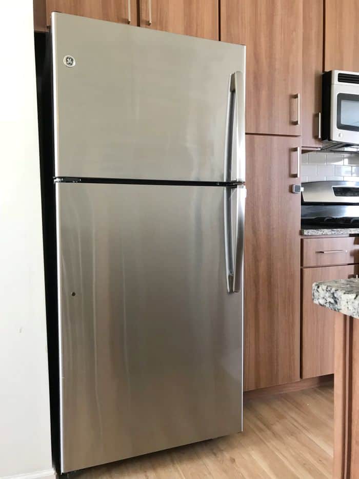 A stainless steel fridge that has just been cleaned