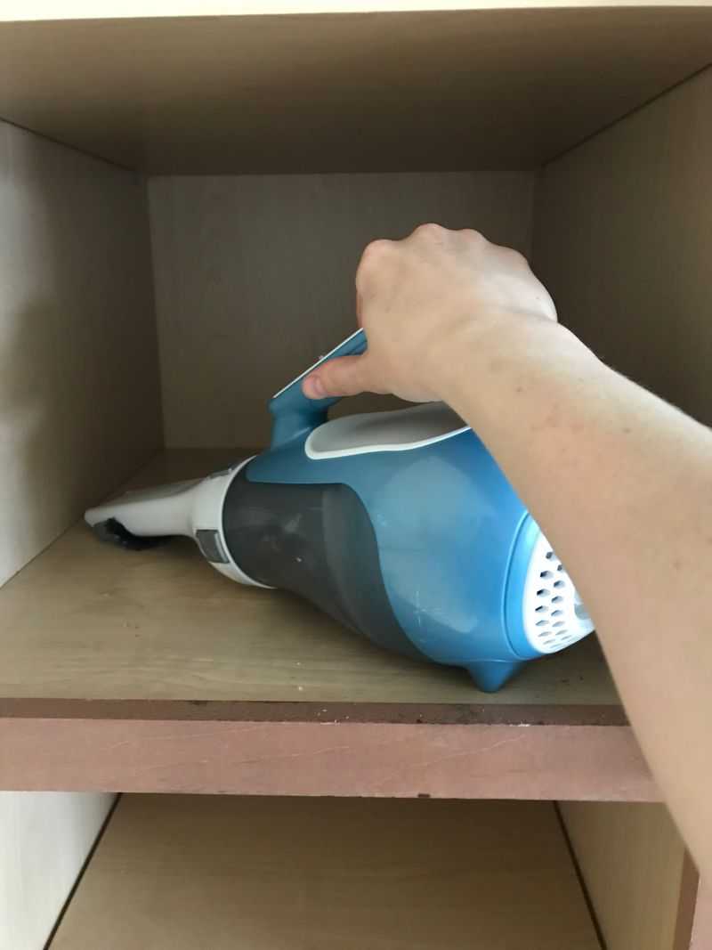 Cleaning empty cabinets with vacuum cleaner