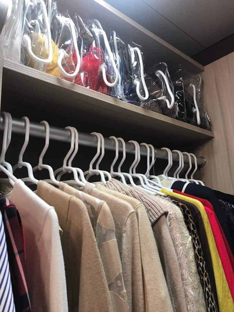 Using uniform hangers to organize closet