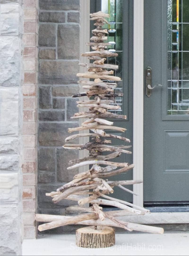 A minimalist wood Christmas tree made from driftwood
