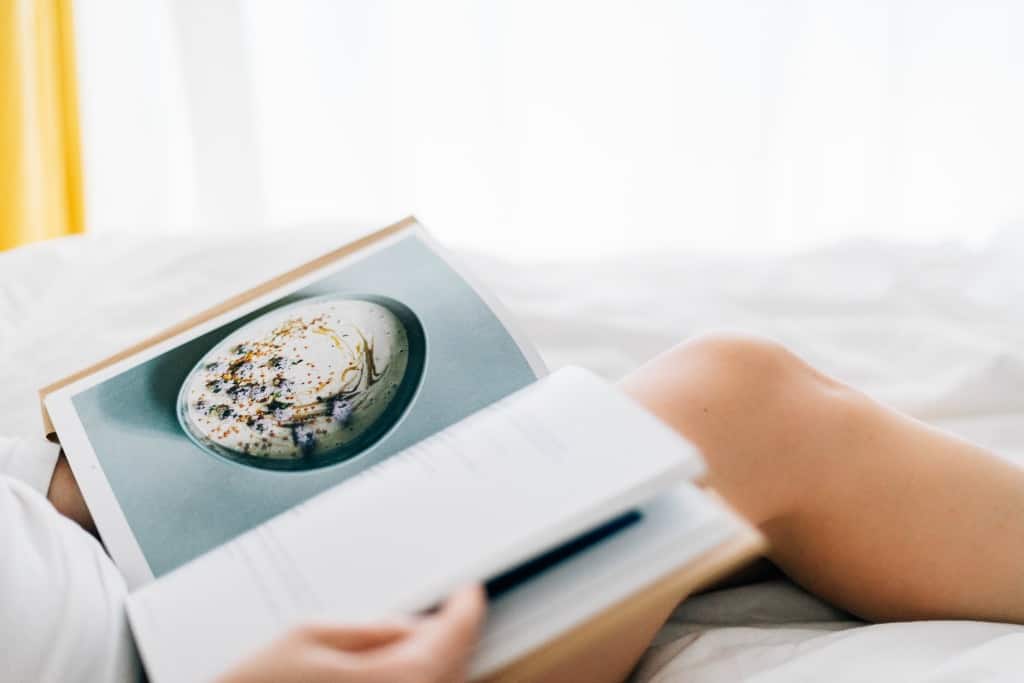 A minimalist woman reading a book