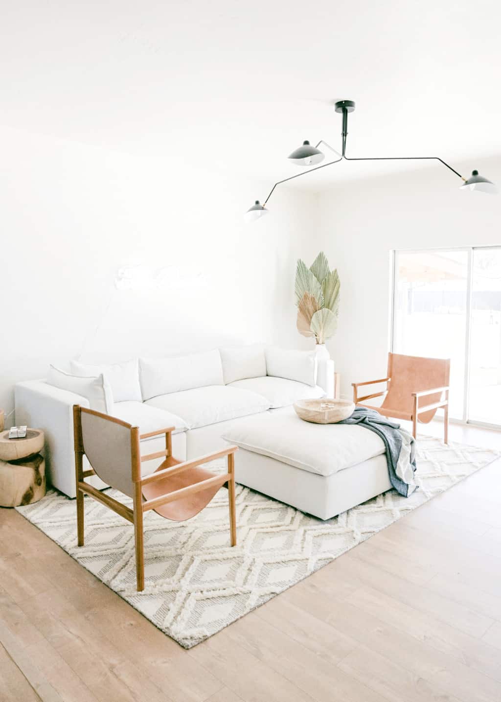 A cozy white minimalist living room with modern decor