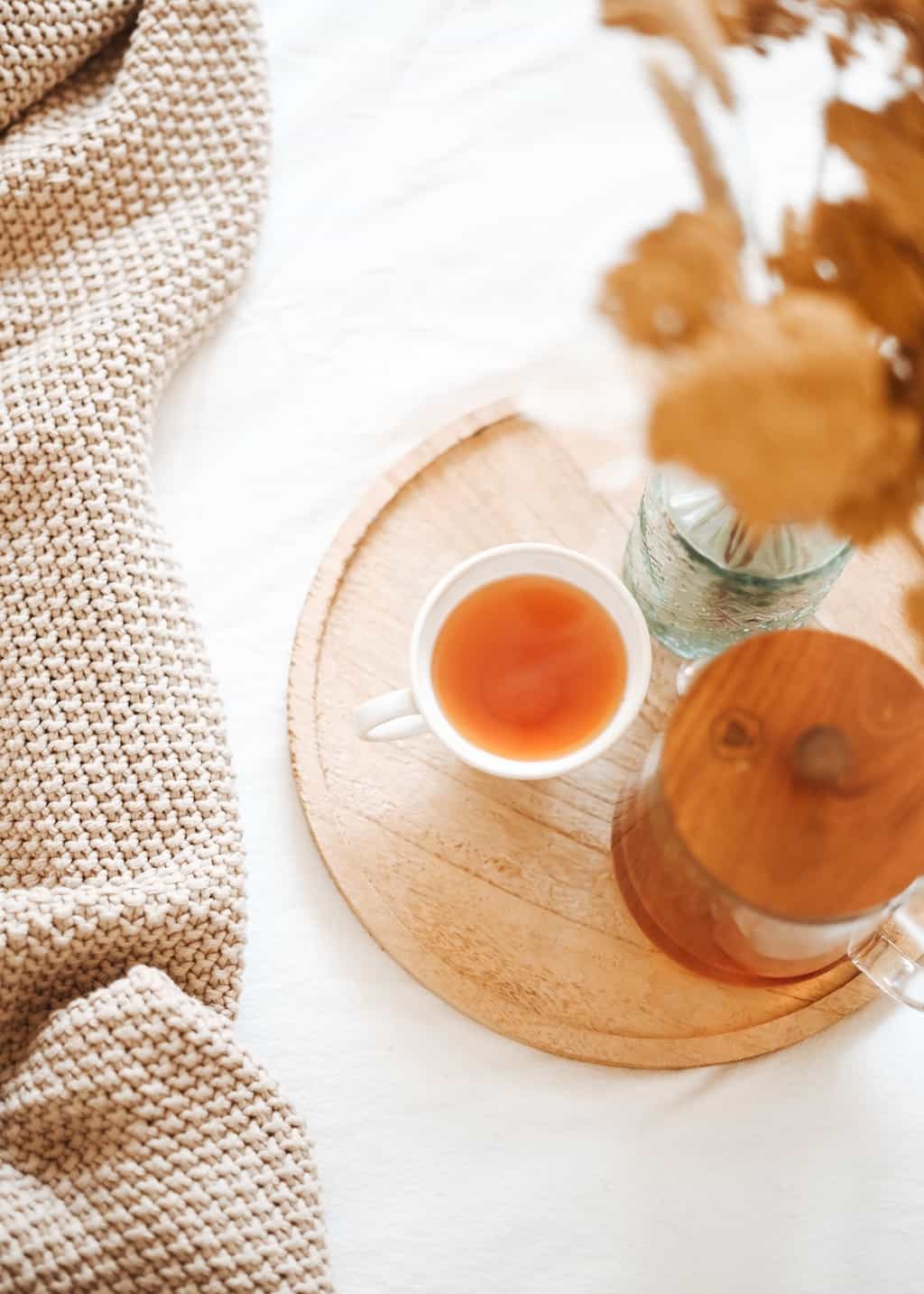 A wooden tray with tea for a daily be intentional practice