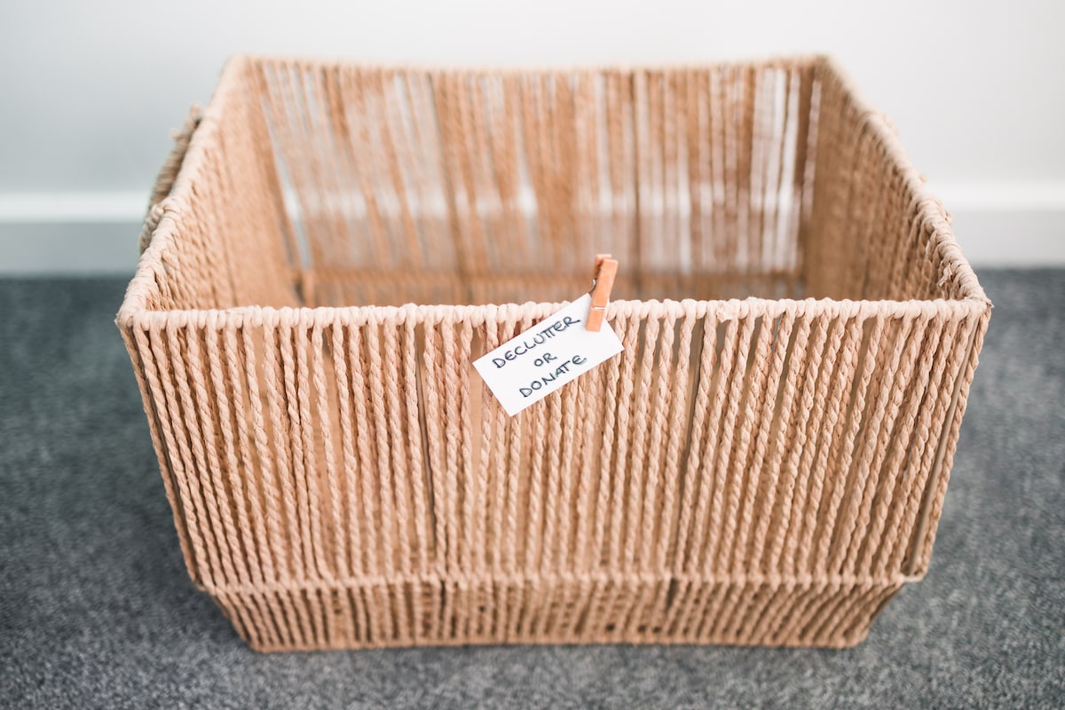 A decluttering tip basket labeled "declutter or donate"