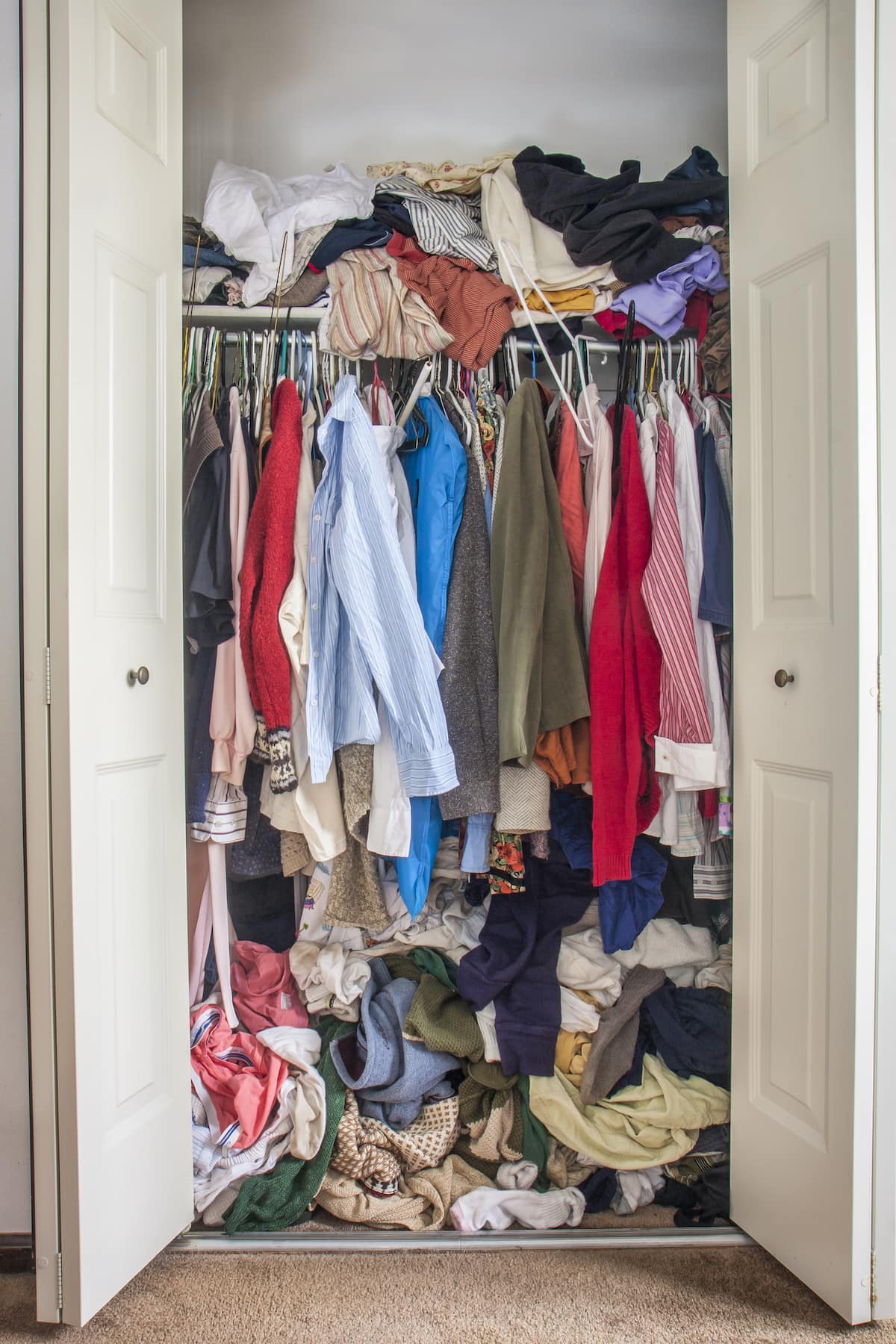 A cluttered closet, one of the best places to start decluttering