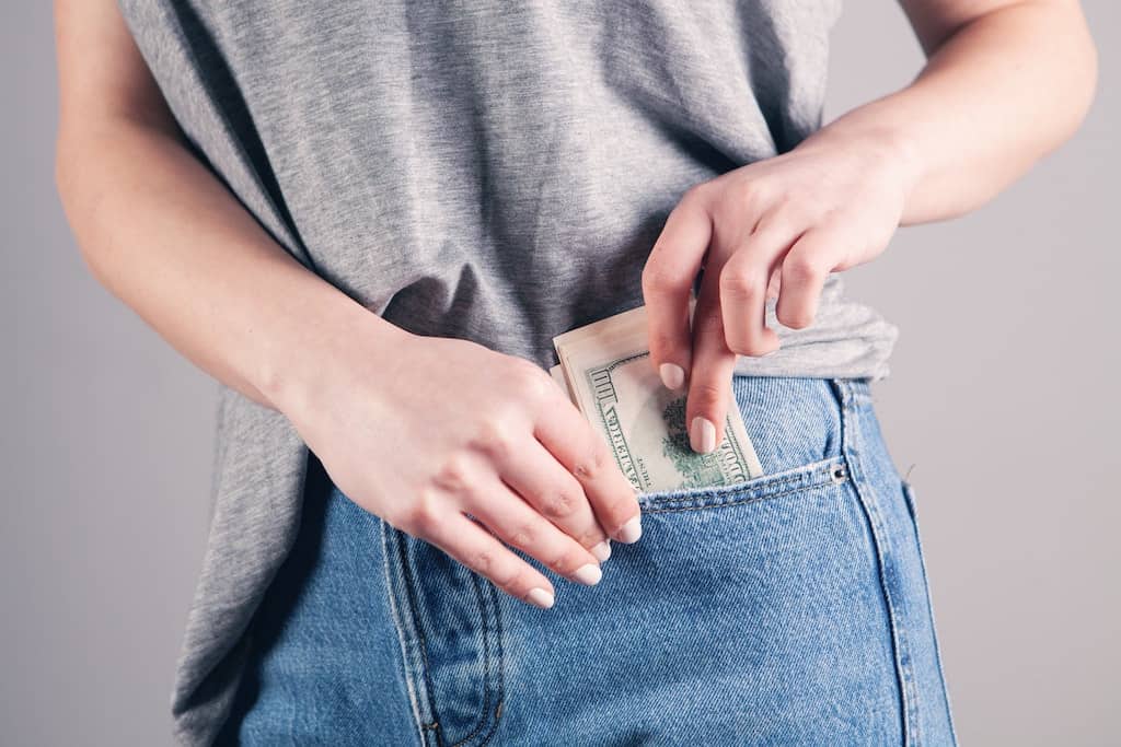 A woman using money hacks to put more money in her pocket