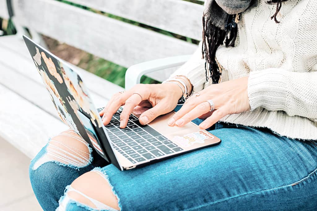 A woman making a purchase she will regret buying on her computer