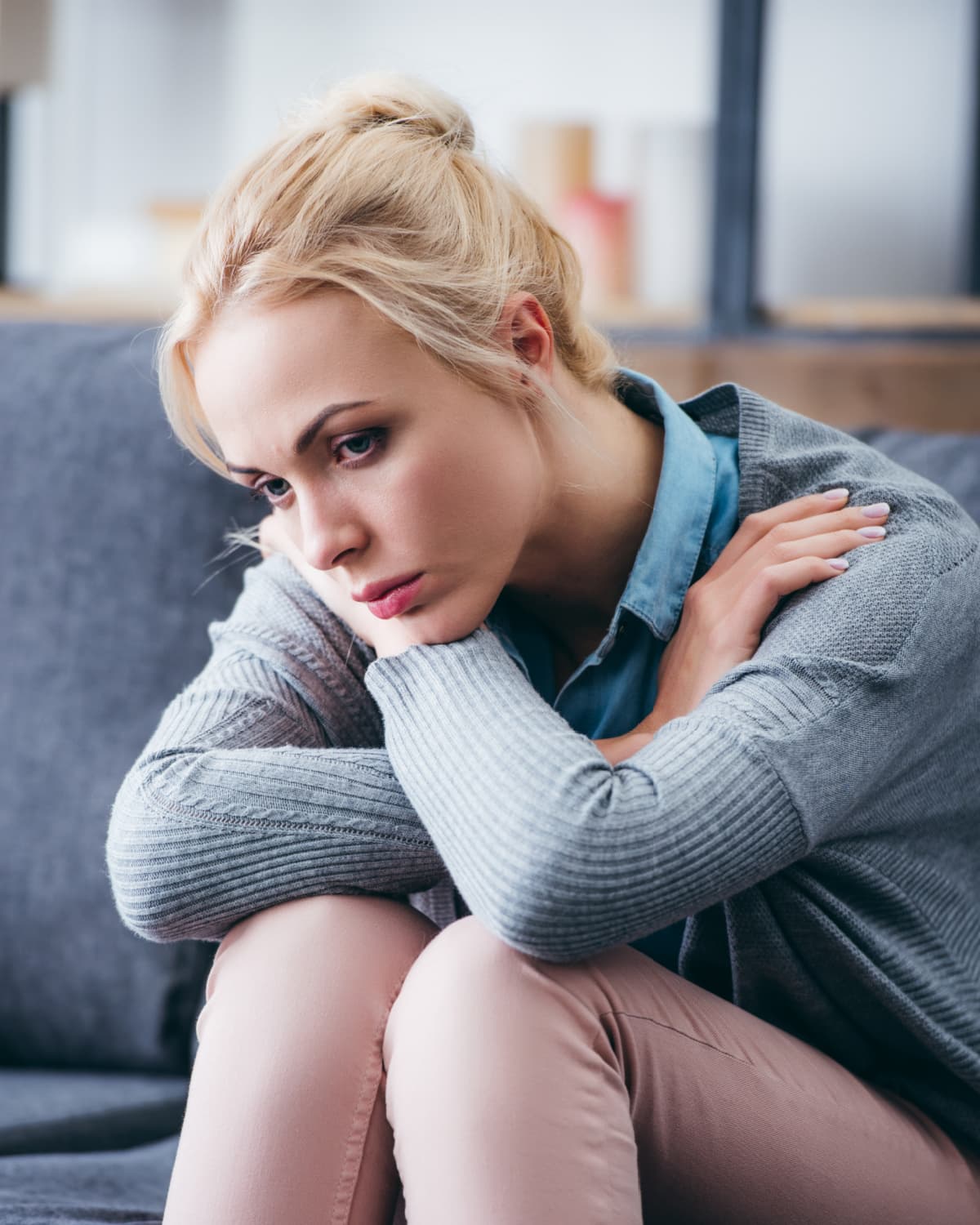 A depressed woman struggling to declutter her home