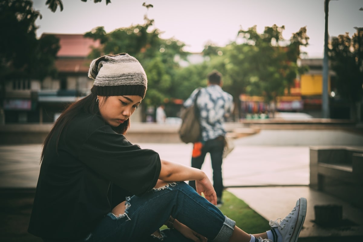 A woman feeling sad after a fight with the selfish person she is in love with.