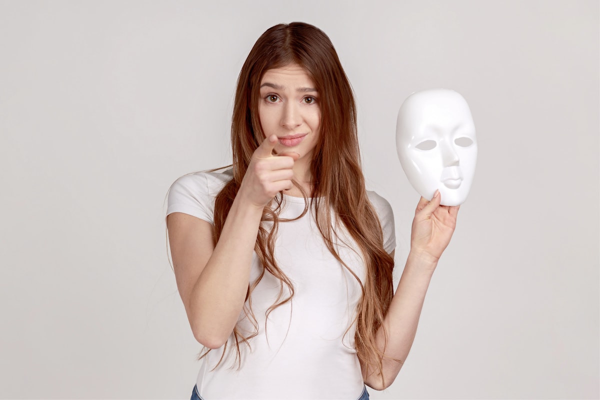 A woman asking "Are you an authentic person?" and holding a mask