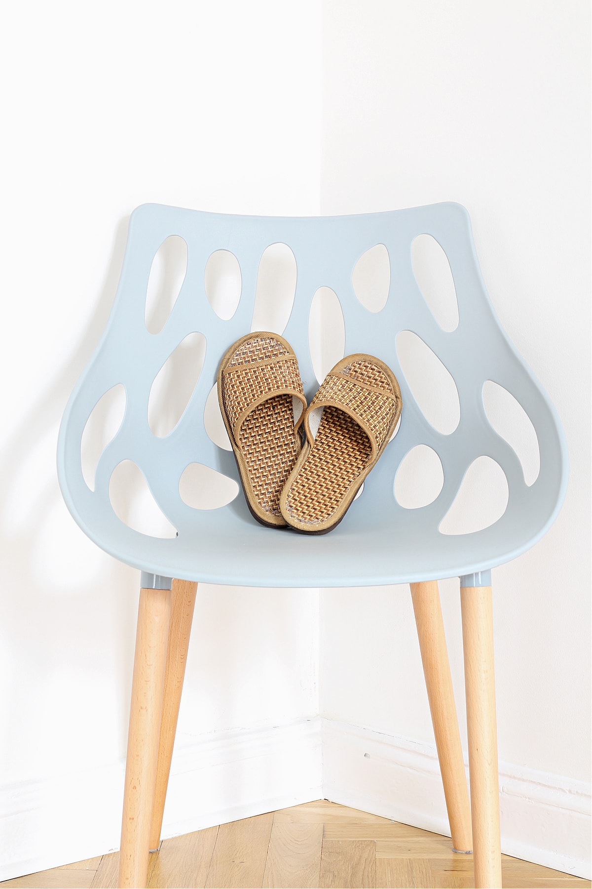 Indoor shoes on a blue chair in a no shoes Chinese home