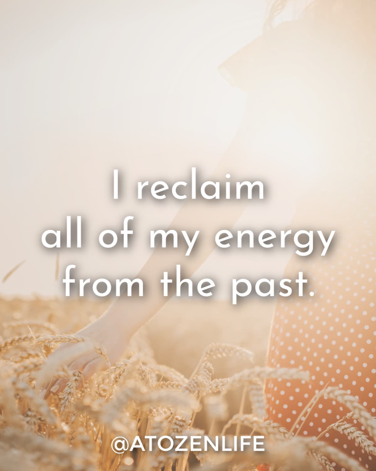 A woman in a field at sunrise saying affirmations about letting go of the past.