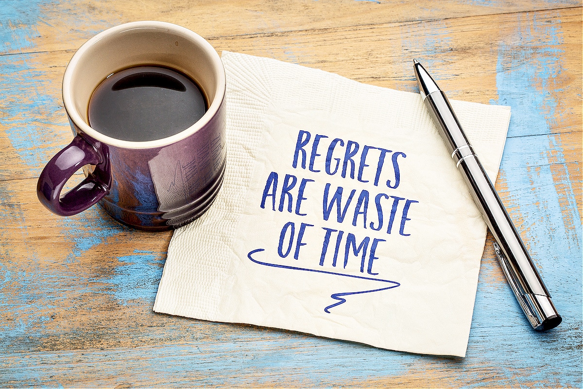 Coffee next to a quote about things that are a waste of time: "Regrets are a waste of time."