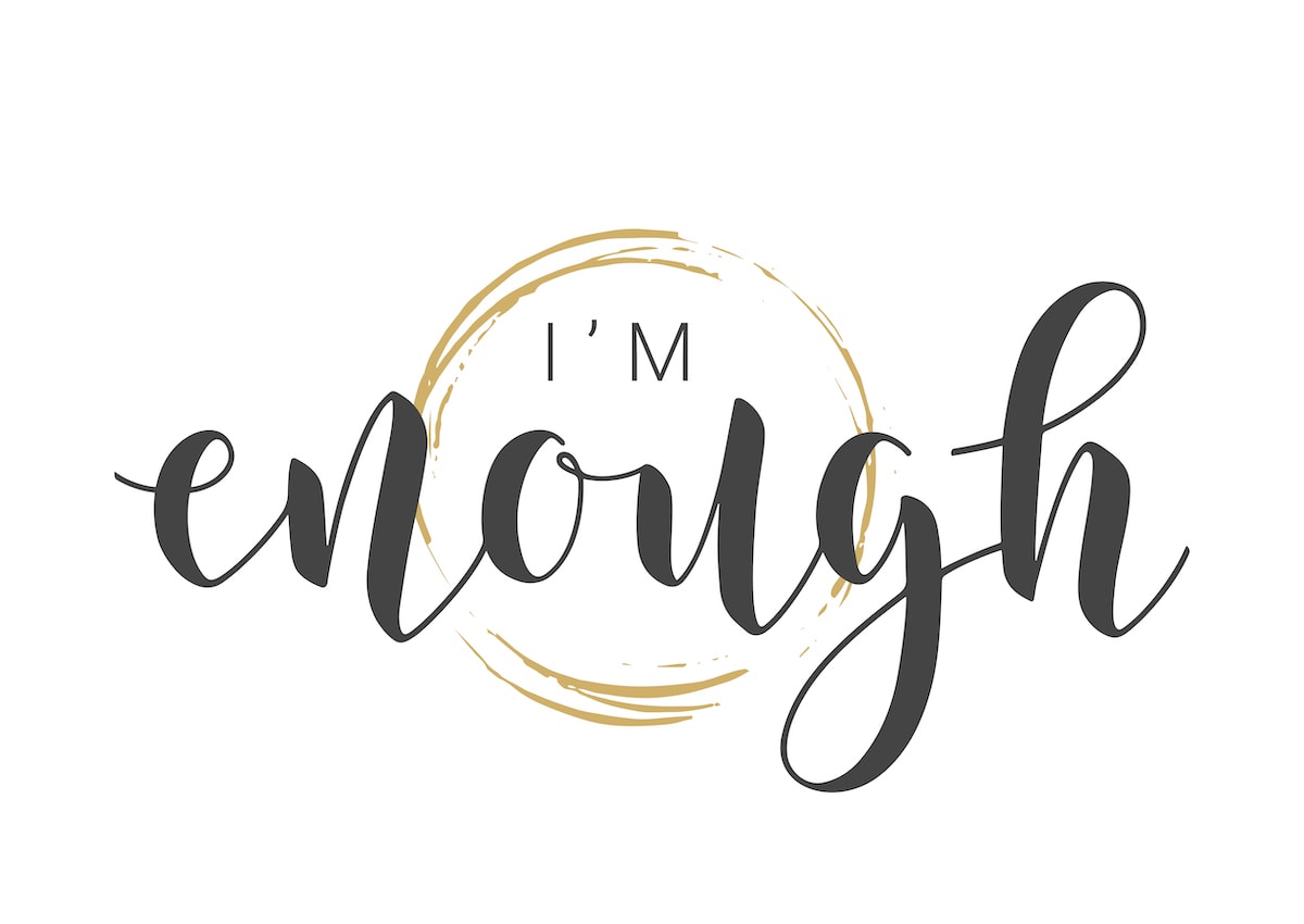 An "I'm enough" quote in black and gold